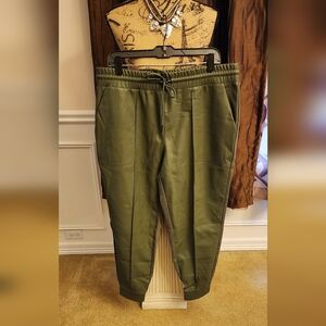 Olive green jogging pants, peather in front and fabric in the back, size  XL.